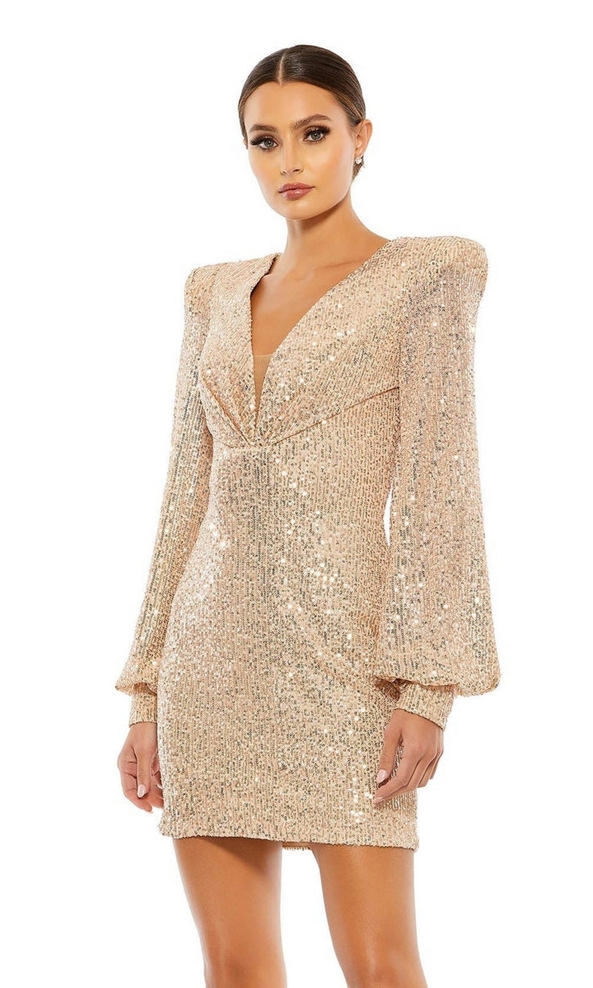 A woman wears the Long Sleeve Sequin Hoco Dress: Mac Duggal 26865, featuring a deep V-neckline and long sleeves, standing against a plain white background.
